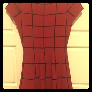 Red dress with black lines.